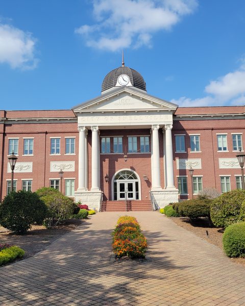 Snellville City Hall with its white portico and clock cupola