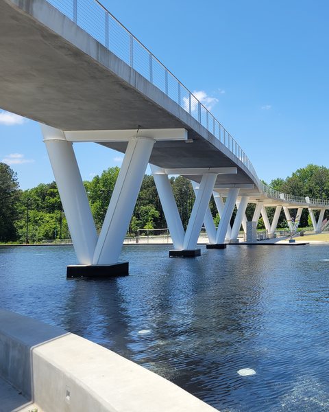The white pedestrian bridge over the pond at Suwanee Town Center